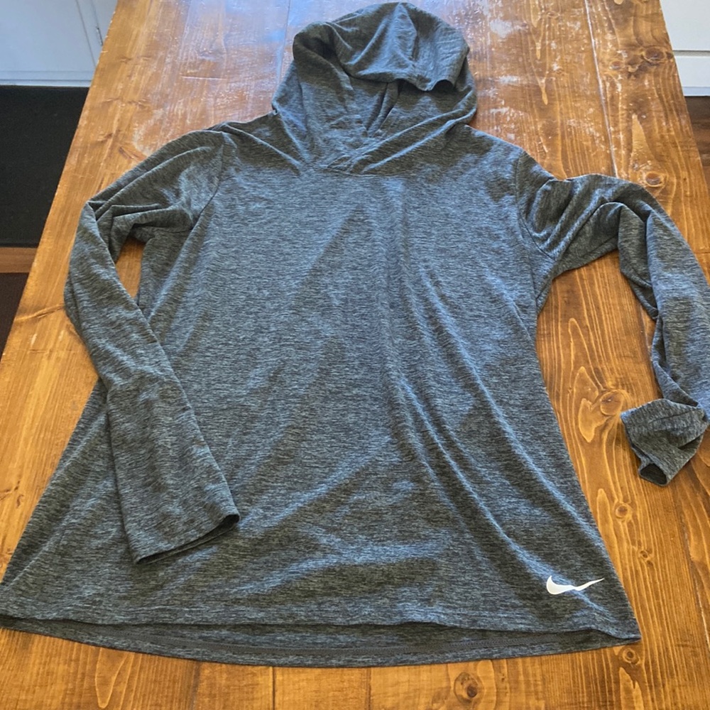 Nike women’s long sleeve dri-fit. Worn but in good condition! Heathered gray.